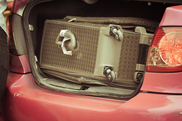 suitcase near a taxi