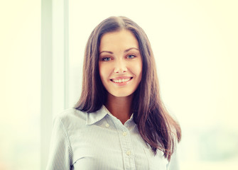 Fototapeta premium happy businesswoman in office