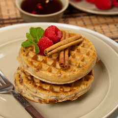 Waffles with raspberries and cinnamon. Selective focus.