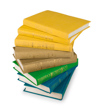 Stack Of Yellow, Green And Blue Books On A White Background Isol