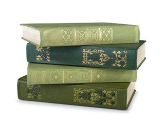stack of vintage books in a green cover on a white background