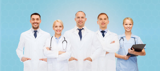 group of doctors with stethoscopes and clipboard
