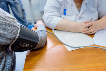 Patient measures the blood pressure