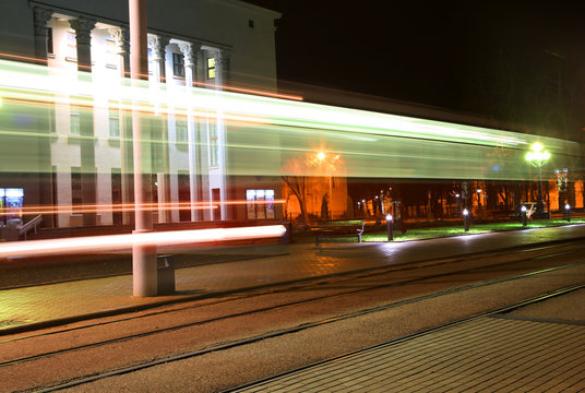 Evening traffic. The city lights. Abstract background. Tram