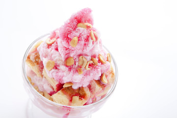Shaved ice and bread with red syrup and sweet milk