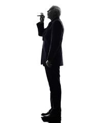 senior business man smoking electronic e-cigarette silhouette