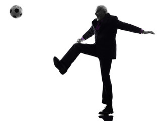 senior business man playing soccer silhouette
