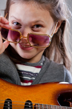girl with guitar and sunglasses