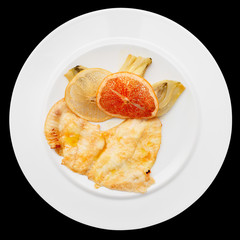 Fish fillet with artichokes and citrus chips, isolated