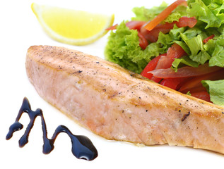 Pink salmon fillet served with salad