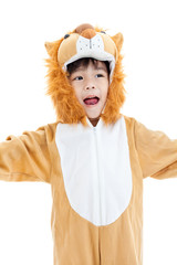 Little lovely asian boy costumed like a lion and looking ahead