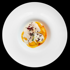 Ravioli with polenta isolated on black