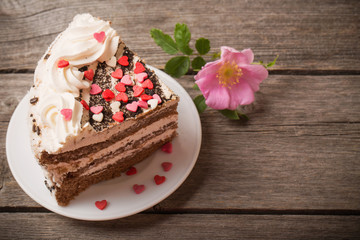 cake with hearts on wooden background