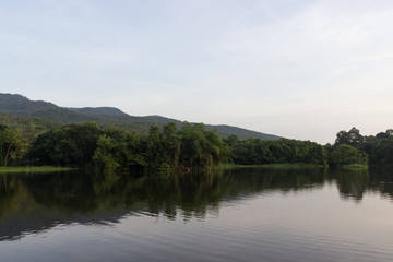 Fototapeta na wymiar Reservoir with shadows reflection of trees