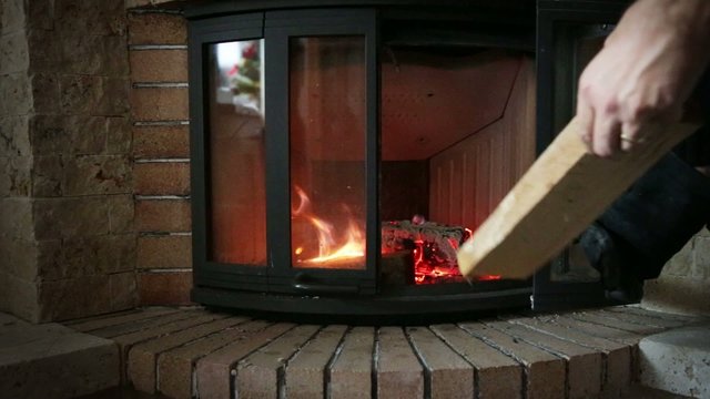 Placing wood inside fireplace