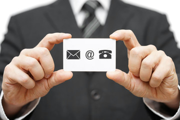 businessman hold business card with email,mail, phone icon. Cont