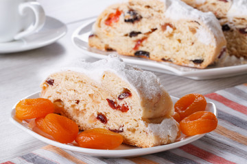 cake with raisins, dried apricots and candied slices closeup