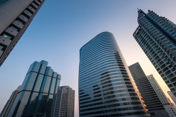 Fototapeta premium Perspective and underside angle view of Modern skyscrapers at su