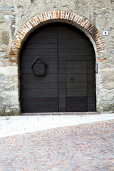 Fototapeta na wymiar italy lombardy in the milano old church door closed br