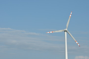 Windmill, production of green energy. Masts with blades