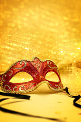 Vintage carnival mask in golden background