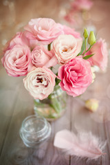 Bright background with roses and feather