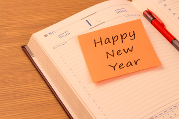 Happy New Year  note on a new year organizer