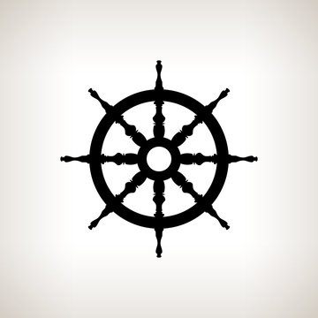 Silhouette ship wheel  on a light background