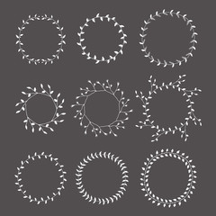 Hand-drawn silhouettes branches wreaths graphic design elements