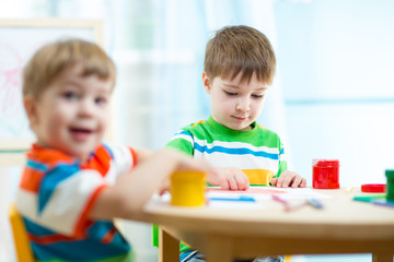 Fototapeta premium kids painting in daycare or nursery or playschool