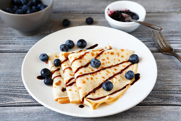 Crepes with chocolate sauce and berries
