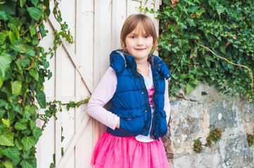 Fototapeta premium Outdoor portrait of a cute little girl