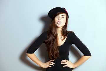 Closeup fashion studio portrait of hipster young girl