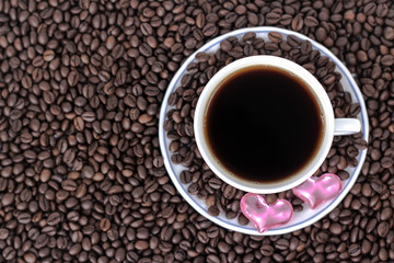 cup of coffee and two hearts on a saucer