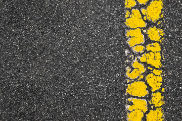 Fototapeta premium Yellow Road Marking Stripe On Asphalt Background