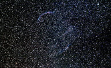 Veil nebula in Cygnus. Red colour is hydrogen, blue is O and N