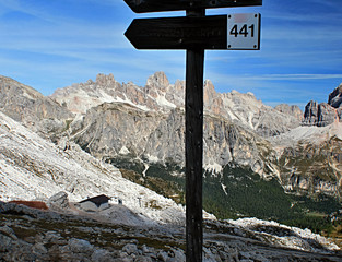 view from Nuvolau through hiking trail sign-post