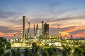 Oil refinery plant at sunset, The night view of petroleum and petrochemical factory with...