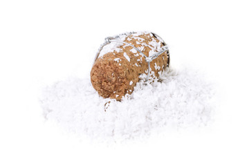 Champagne cork in the snow on a white background