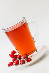 Glass of rosehip tea isolated on white background.  Tisane
