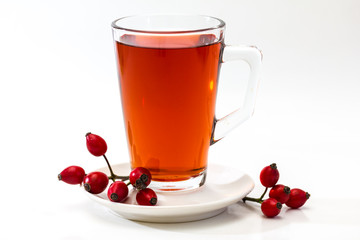 Glass of rosehip tea isolated on white background.  Tisane