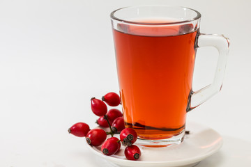 Glass of rosehip tea isolated on white background.  Tisane