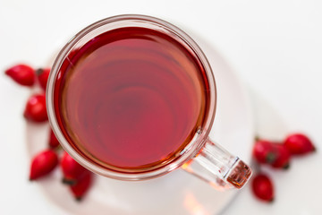 Glass of rosehip tea isolated on white background.  Tisane