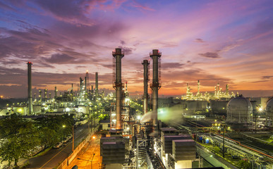 Oil refinery plant at sunset, The night view of petroleum and petrochemical factory with...