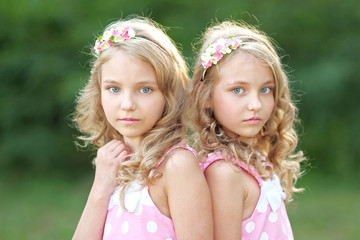 Portrait of two little girls twins