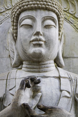Close up view of a beautiful Buddha statue on a park.