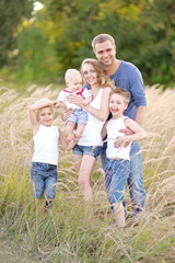 Fototapeta premium portrait of happy family relaxing in nature summer