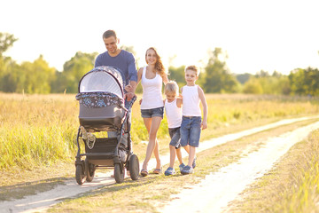 portrait of happy family relaxing in nature summer