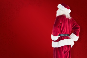 Composite image of santa looks away from the camera