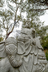 Close up view of a beautiful Buddha statue on a park.